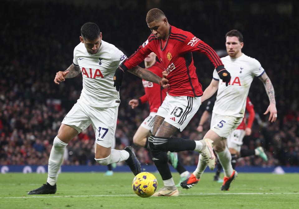 Cristian Romero and Micky van de Ven put their bodies on the line to play (Manchester United via Getty Images)