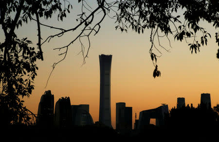 The cityscape of the Beijing Central Business District, or Beijing CBD, is silhouetted against the sky during sunset, China October 17, 2018. REUTERS/Thomas Peter