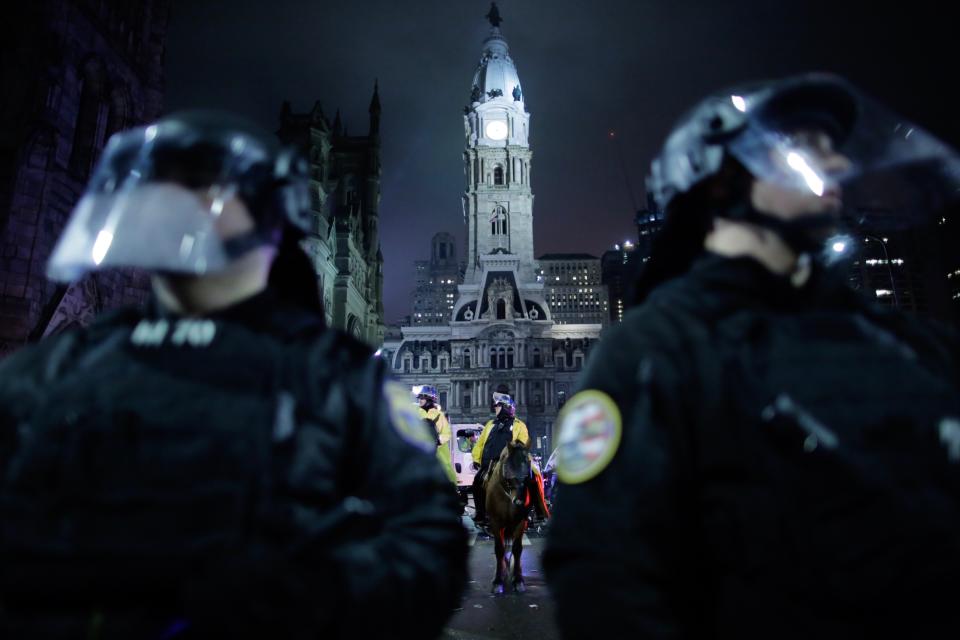 <p>Police officers stand guard as Philadelphia Eagles fans celebrate victory in Super Bowl LII game against New England Patriots on February 4, 2018 in Philadelphia, Pennsylvania..(Photo by Eduardo Munoz Alvarez/Getty Images) </p>