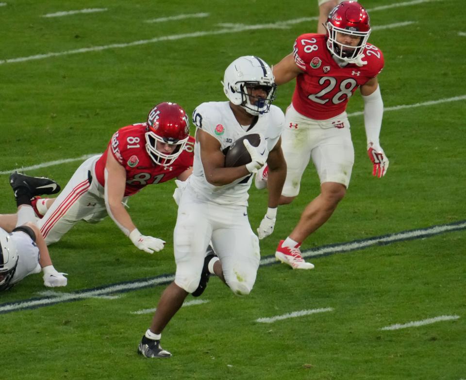 Penn State running back Nicholas Singleton runs for an 87-yard touchdown against Utah.