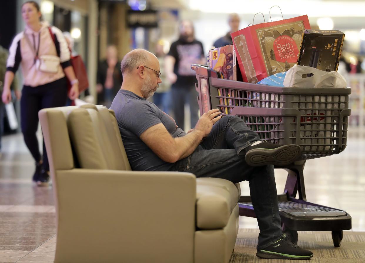 James Whiteaker takes a break while shopping with family at Fox River Mall in Grand Chute.