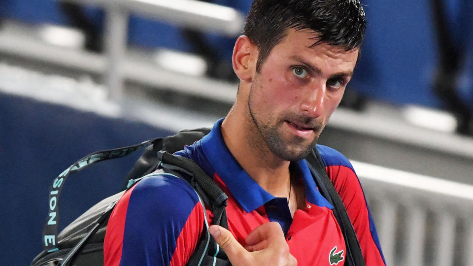 Novak Djokovic could be risking being banned from Australia for as long as three years, legal experts have warned ahead of him challenging his visa cancellation in court. (Photo by TIZIANA FABI/AFP via Getty Images)