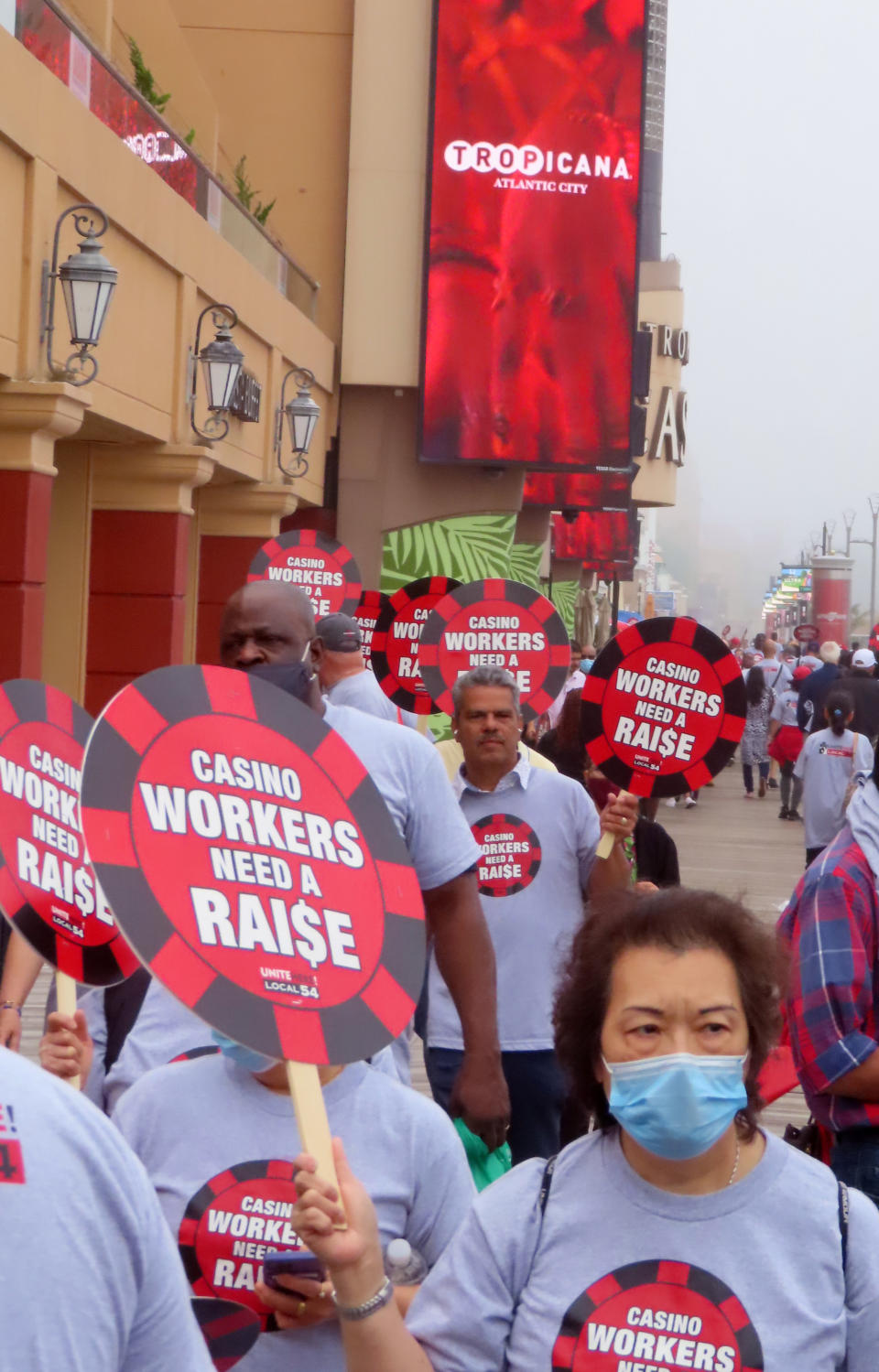 Union members picket outside the Tropicana casino in Atlantic City N.J. on June 1, 2022. The main casino workers union is threatening a strike against at least 5 casinos in July if new contracts are not reached by then, and on Wednesday, June 22, the City Council of Atlantic City called on the casinos to avert a strike by paying workers more and hiring more of them. (AP Photo/Wayne Parry)