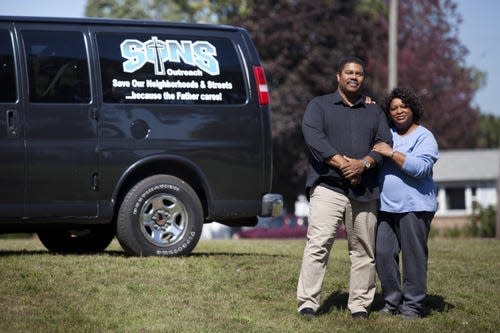 SONS Outreach Executive Director Tyrone Burrell stands with his wife Laura Burrell on Sept. 16, 2015 at 3001 Electric Ave. in Port Huron.