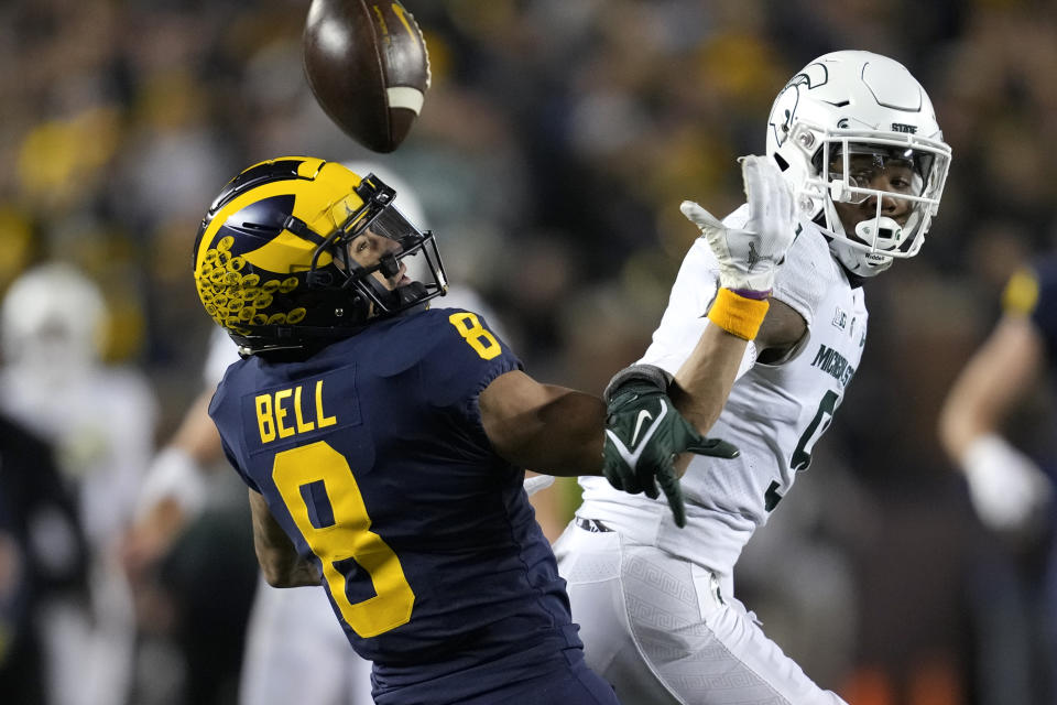 Michigan State cornerback Ronald Williams (9) breaks up a pass intended forMichigan wide receiver Ronnie Bell (8) in the second half of an NCAA college football game in Ann Arbor, Mich., Saturday, Oct. 29, 2022. (AP Photo/Paul Sancya)