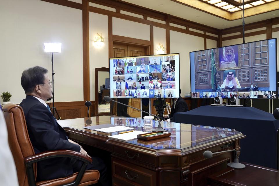 FILE - In this March 26, 2020, file photo provided by South Korea Presidential Blue House via Yonhap News Agency, South Korean President Moon Jae-in attends G-20 virtual summit to discuss the coronavirus disease outbreak at the presidential Blue House in Seoul, South Korea. The Nov. 21-22, 2020, Group of 20 summit, hosted by Saudi Arabia, will be held online this year because of the coronavirus. The pandemic has offered the G-20 an opportunity to prove how such bodies can facilitate international cooperation in crises — but has also underscored their shortcomings. (South Korea Presidential Blue House/Yonhap via AP, File)