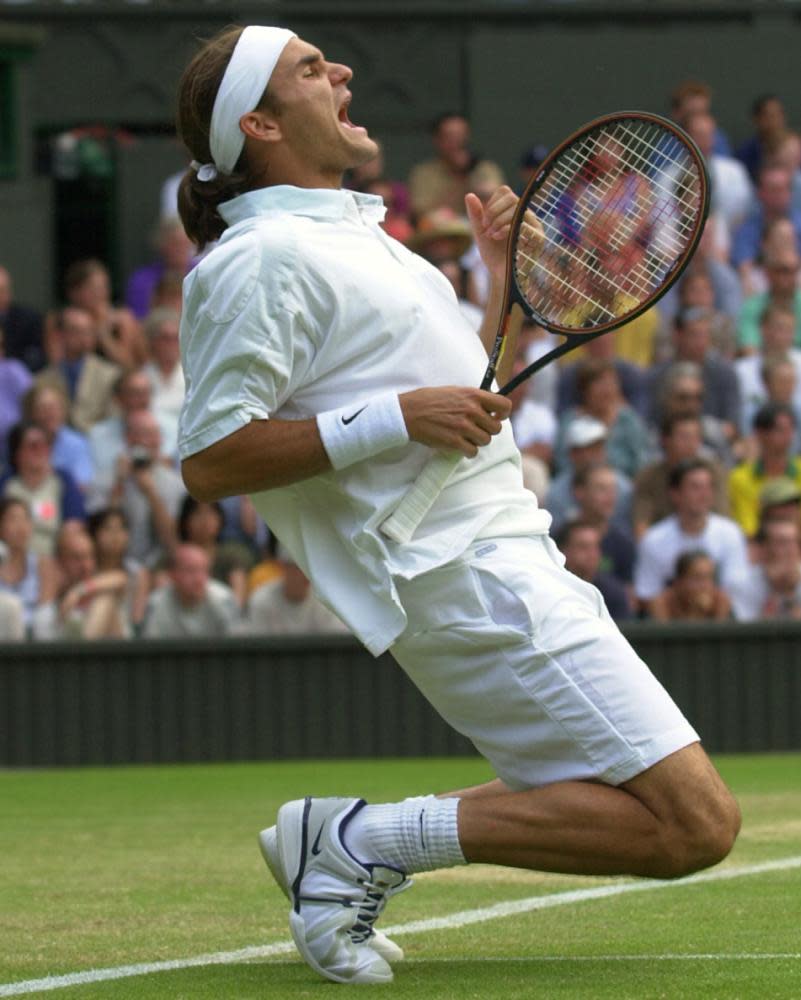 The ponytailed 19-year-old Federer reacts to beating Pete Sampras at Wimbledon in 2001