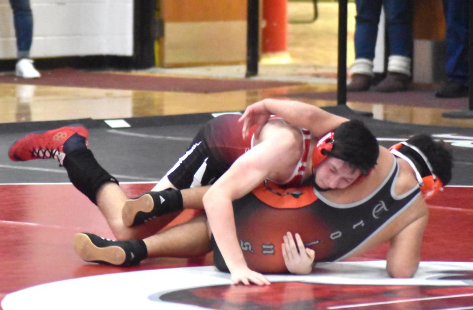 Coldwater's Cody Morick hits a takedown versus Sturgis in what would become the dual clinching victory Saturday