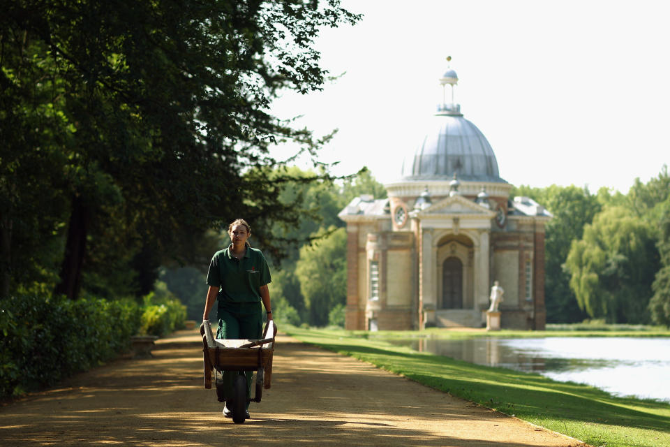 Garden apprentice Joanna Huckvale walks in the grounds near the Archer Pavillion at Wrest Park.