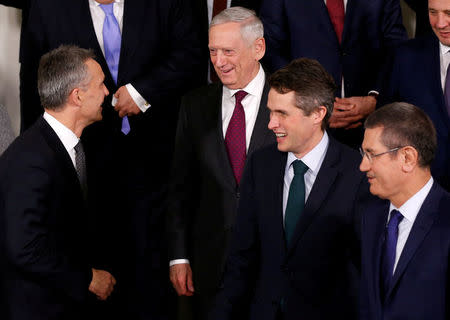 NATO Secretary-General Jens Stoltenberg, U.S. Secretary of Defence Jim Mattis, Britain's Secretary of State for Defence Gavin Williamson and Turkish Defence Minister Nurettin Canikli pose for a family photo during a NATO defence ministers meeting at the Alliance headquarters in Brussels, Belgium, February 14, 2018. REUTERS/Francois Lenoir