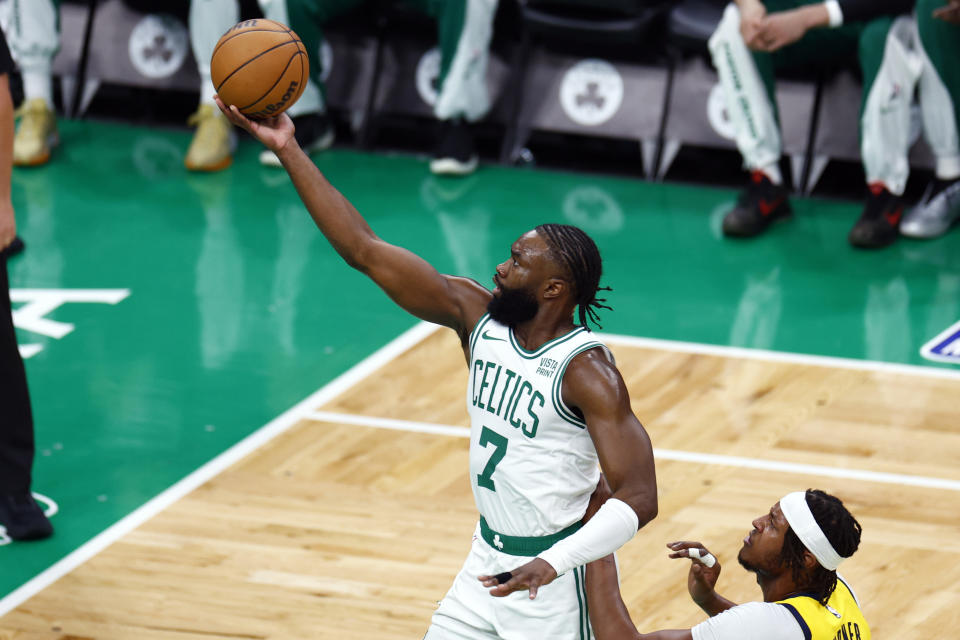 Boston, MA - May 21: Boston Celtics guard Jaylen Brown scores over Indiana Pacers center Myles Turner in the first quarter of Game 1 of the 2024 Eastern Conference Finals. (Photo by Danielle Parhizkaran/The Boston Globe via Getty Images)