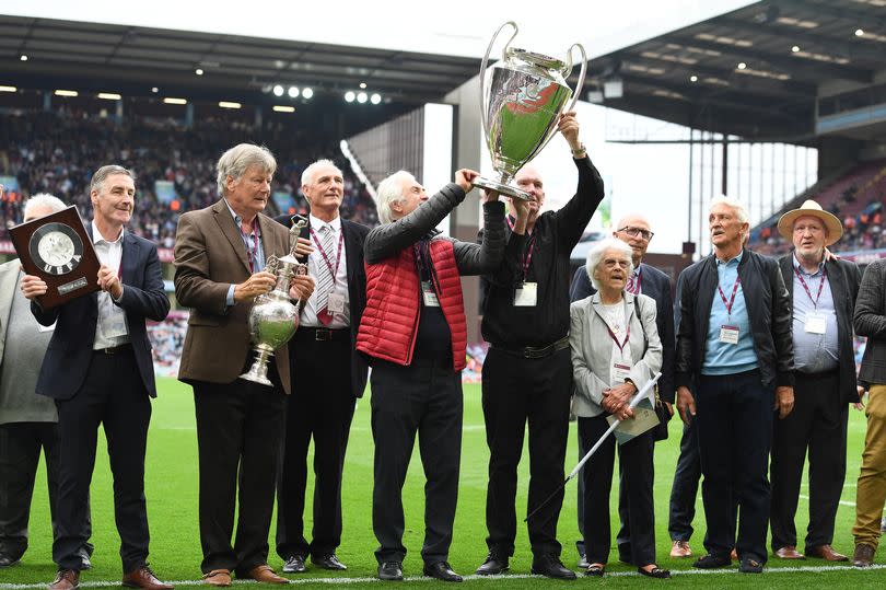 Players of the 1982 European Cup winning Aston Villa side celebrate with the European Cup trophy