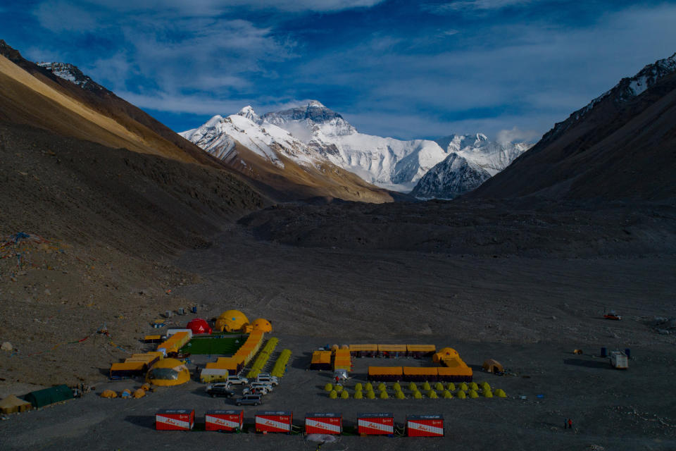 In this aerial photo released by Xinhua News Agency, the Mount Qomolangma, also known as Mount Everest, base camp is seen on May 25, 2020. China will draw a “separation line” atop Mount Everest to prevent the coronavirus from being spread by climbers ascending from Nepal's side of the mountain, Chinese state media reported Monday, May 10, 2010. (Purbu Zhaxi/Xinhua via AP)