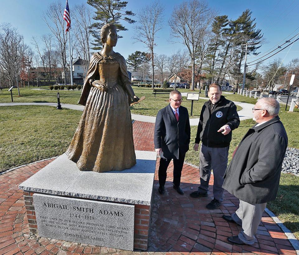 Dennis Keohane, left, who donated the statue of Abigail Adams, stands with Weymouth Mayor Robert Hedlund and John MacLeod, director of asset management for the town, in the new Heritage Park.