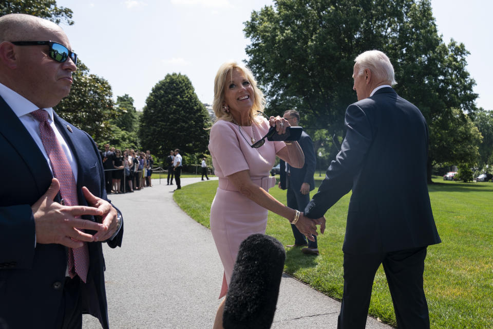 First lady Jill Biden smiles as she walks off with President Joe Biden to board Marine One on the South Lawn of the White House, Friday, June 17, 2022, in Washington. (AP Photo/Evan Vucci)