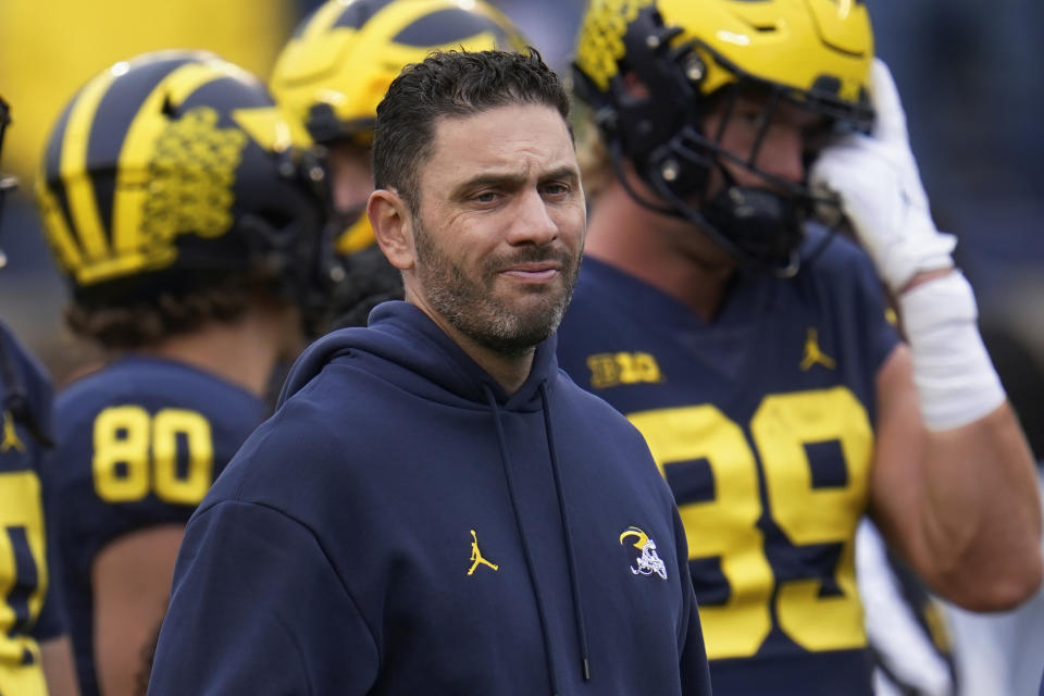 Michigan co-offensive coordinator and quarterbacks coach Matt Weiss watches before an NCAA college football game against Maryland in Ann Arbor, Mich., Saturday, Sept. 24, 2022. (AP Photo/Paul Sancya)