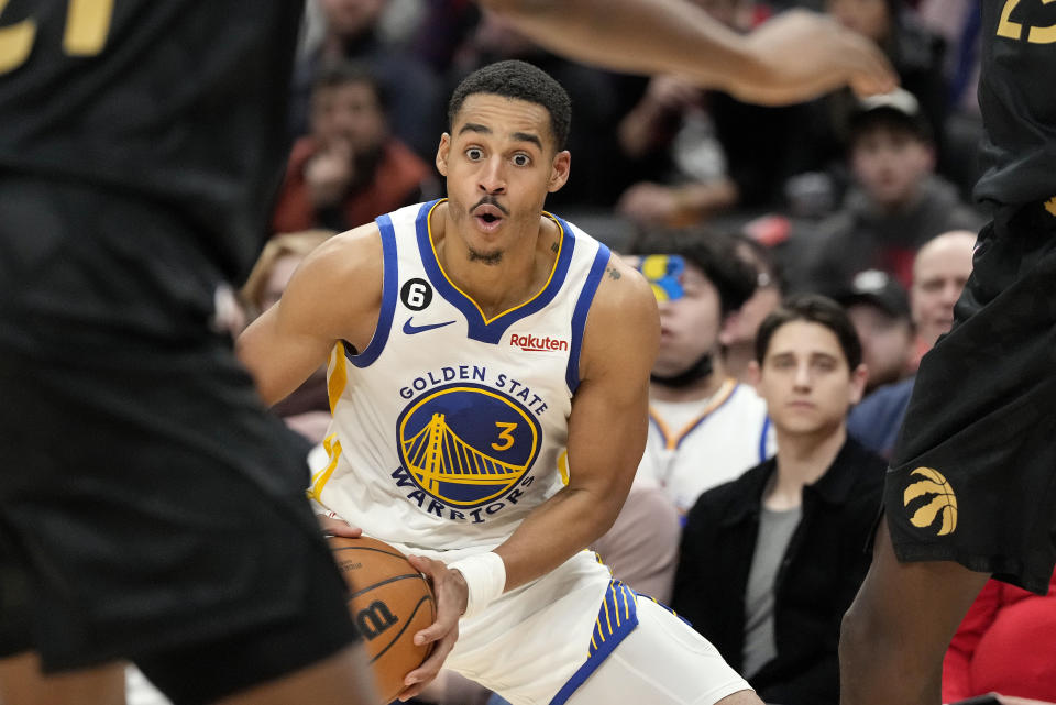 Golden State Warriors guard Jordan Poole looks on during the second half of an NBA basketball game in Toronto, Sunday, Dec. 18, 2022. (Frank Gunn/The Canadian Press via AP)