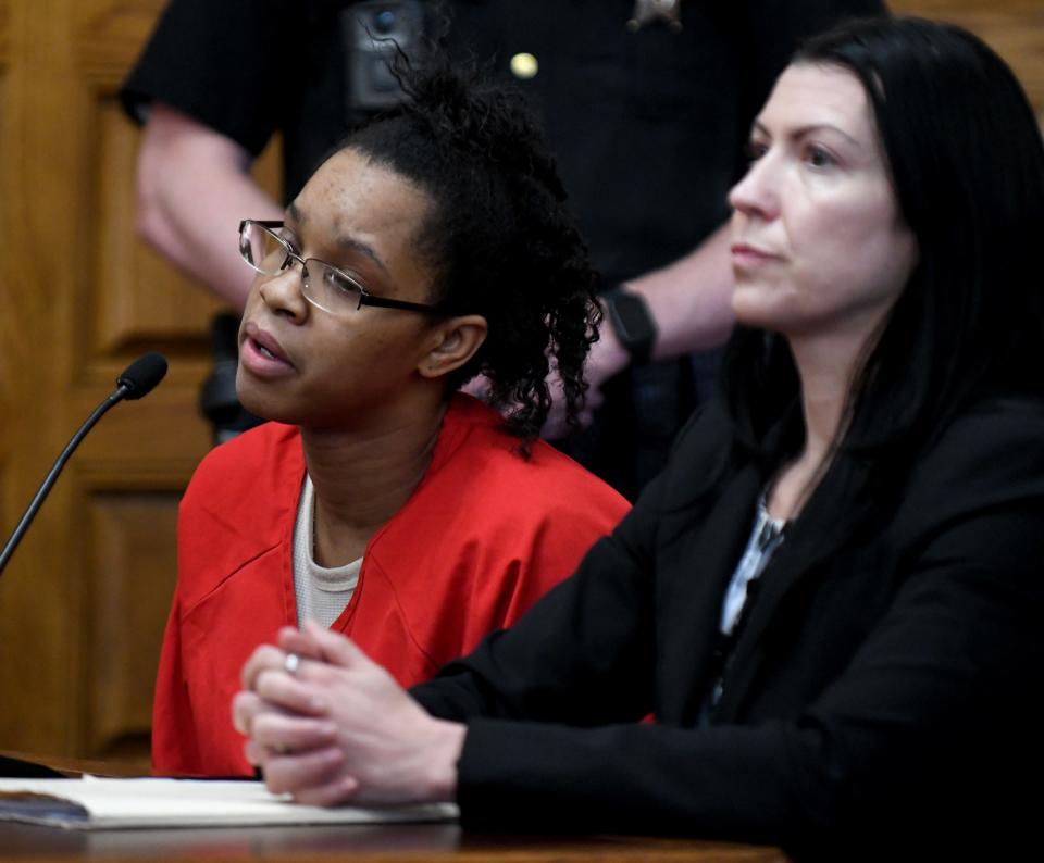 Chabrijuana J. Glenn, left, is shown with defense attorney Tiffany Poirier as she enters a guilty plea in Stark County Common Pleas Court for killing Douglas G. Adkins. Judge Natalie R. Haupt sentenced Glenn to 23 years to life in prison.