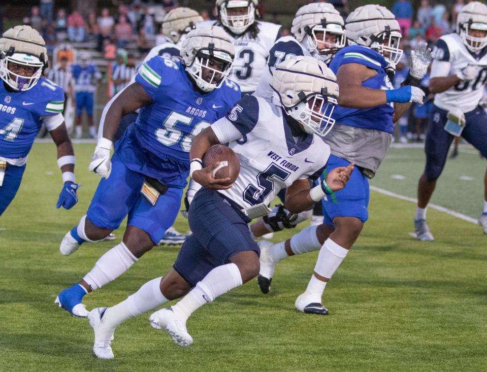 Shomari Mason (5) carries the ball during the spring football game at the University of West Florida in Pensacola on Thursday, April 14, 2022.