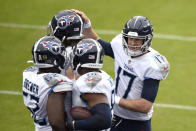 Tennessee Titans quarterback Ryan Tannehill (17) celebrates with teammates after he connected with tight end Jonnu Smith (81) on a touchdown pass against the Baltimore Ravens during the first half of an NFL football game, Sunday, Nov. 22, 2020, in Baltimore. (AP Photo/Gail Burton)