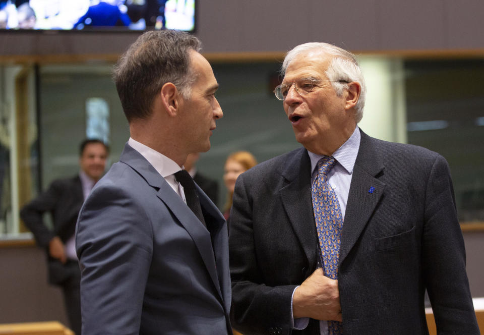 German Foreign Minister Heiko Maas, left, speaks with European Union foreign policy chief Josep Borrell during a meeting of EU foreign ministers at the Europa building in Brussels, Monday, Dec. 9, 2019. European Union foreign ministers are debating how to respond to a controversial deal between Turkey and Libya that could give Ankara access to a contested economic zone across the Mediterranean Sea. (AP Photo/Virginia Mayo)