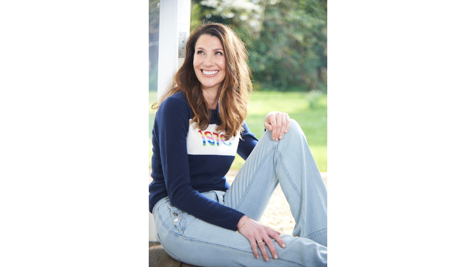 Rosie Green smiling in jeans and jumper