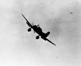 <p>A Japanese navy Type 99 Val carrier bomber is seen in action during the attack on Pearl Harbor on Dec. 7, 1941. (U.S. Navy/National Archives/Handout via Reuters) </p>