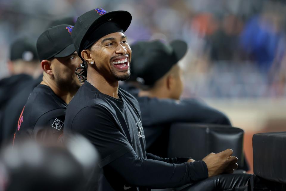 New York Mets shortstop Francisco Lindor (12) laughs in the dugout during the ninth inning against the Philadelphia Phillies on Sept. 20, 2024, at Citi Field.