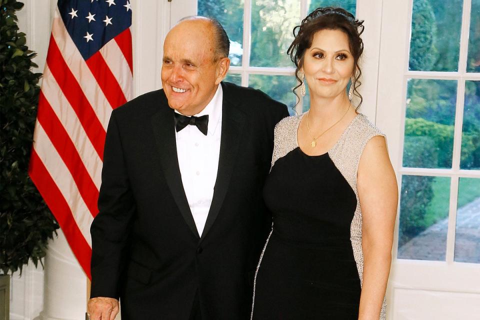 Giuliani pictured with his alleged ‘girlfriend’ Maria Ryan, whom creditors accuse him of giving ‘unauthorized payments’ (Getty Images)