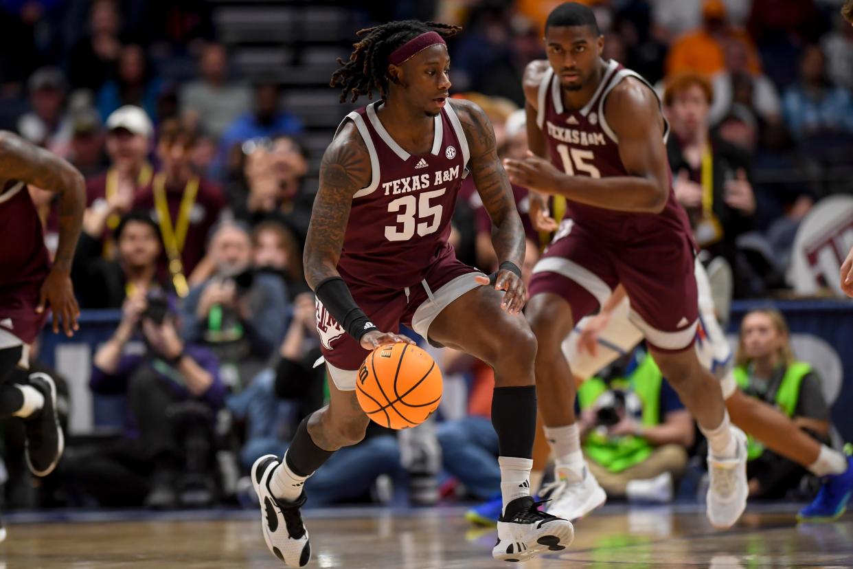 Texas A&M Aggies guard Manny Obaseki (35) dribbles up court.