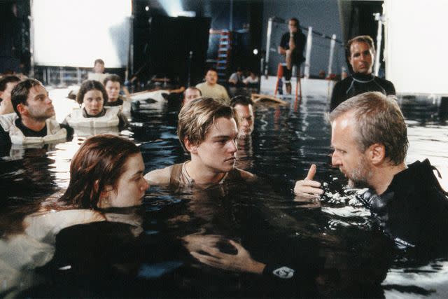 <p>20th Century Fox/Paramount/Kobal/Shutterstock </p> Kate Winslet, Leonardo DiCaprio and James Cameron filming 'Titanic'