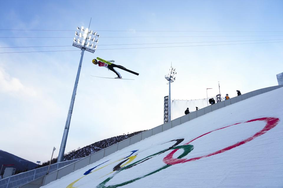 Johannes Lamparter, of Austria, soars through the air during the competition round of the individual Gundersen large hill/10km ski jumping competition at the 2022 Winter Olympics, Tuesday, Feb. 15, 2022, in Zhangjiakou, China. (AP Photo/Andrew Medichini)