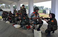 <p>Afghan army cadets take part in a firing excercise during a training programme at the Officers Training Academy in Chennai on December 11, 2017. Twenty female Afghan army cadets are taking part in an Indian military training programme. (Photo by STR/AFP/Getty Images) </p>