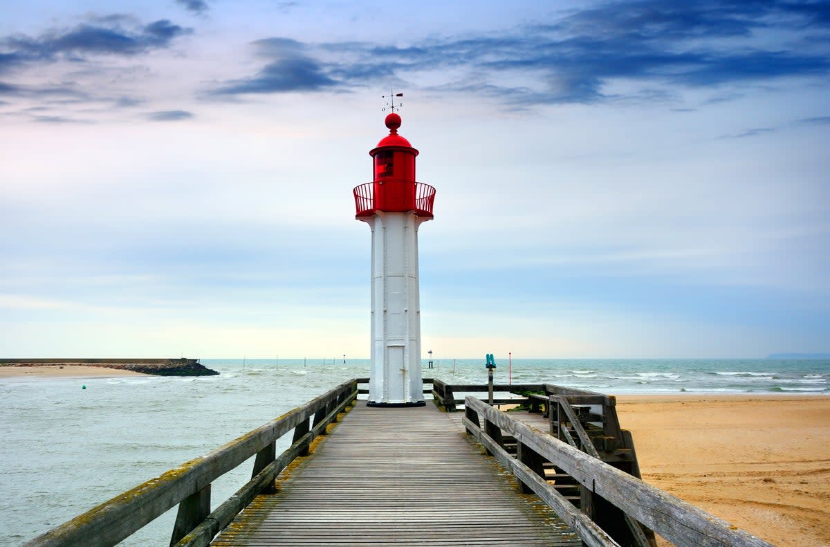 The Lighthouse in Trouville-sur-Mer harbour is a picturesque sight in Normandy  (Getty Images/iStockphoto)