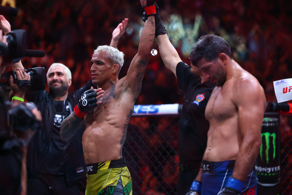 Jun 10, 2023; Vancouver, BC, Canada; Charles Oliveira is declared the winner by TKO victory against Beneil Dariush during UFC 289 at Rogers Arena. Mandatory Credit: Sergei Belski-USA TODAY Sports