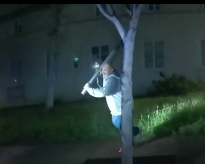 A still from an Oxnard police officer's body-worn camera footage shows the scene moments before a fatal police shooting as a man advanced on officers carrying a large steel bar Sunday morning. The video was released Friday evening.