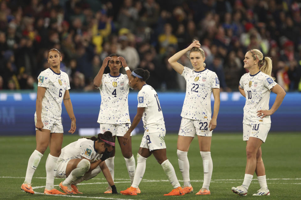 FILE - United States' players react after losing their Women's World Cup round of 16 soccer match against Sweden in a penalty shootout in Melbourne, Australia, Aug. 6, 2023. The U.S. women’s national team embarks on the 2024 Olympics in transition. The team’s slide from dominance on the world stage was evident by their early exit at last year’s Women’s World Cup. (AP Photo/Hamish Blair, File)