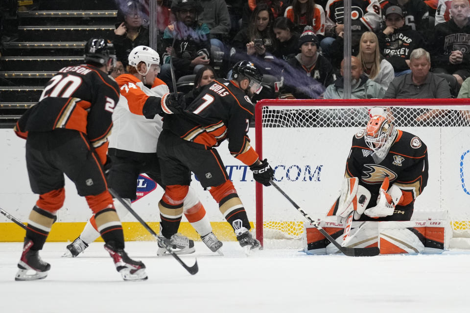 Anaheim Ducks goaltender Lukas Dostal (1) stops a shot. By Philadelphia Flyers right wing Owen Tippett (74) during the third period of an NHL hockey game in Anaheim, Calif., Friday, Nov. 10, 2023. (AP Photo/Ashley Landis)