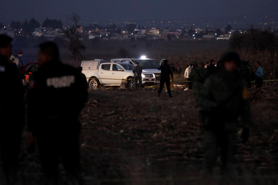 Emergency rescue personnel, the army and the police arrive to the scene of a helicopter crash where Puebla Gov. Martha Erika Alonso and her husband Rafael Moreno Valle, a former Puebla governor, died near Puebla City, southeast of Mexico City on Monday, Dec. 24, 2018. The husband-and-wife political power couple died Christmas Eve in the crash, Mexican officials reported. (AP Photo/Pablo Spencer)