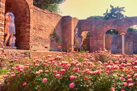 Ruins (and flowers) at Ostia - Credit: getty