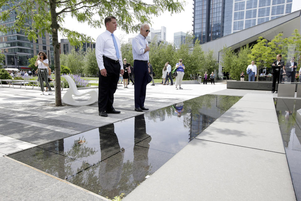Former vice president and Democratic presidential candidate Joe Biden, right, pauses with Boston Mayor Marty Walsh, left, at a memorial to fallen servicemen on Wednesday, June 5, 2019, in Boston. (AP Photo/Steven Senne)