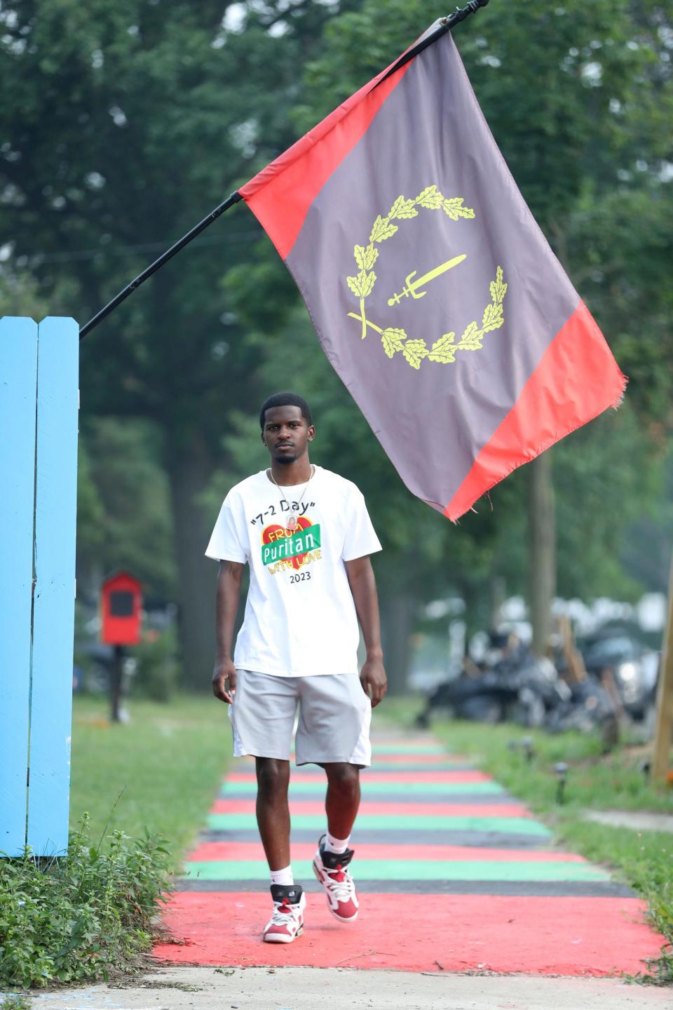 Jerjuan Howard at the Umoja Village on Thursday June 29, 2023. Howard has repurposed this lot on the corner of Stansbury and Puritan a 5K run will be held along Puritan this weekend.