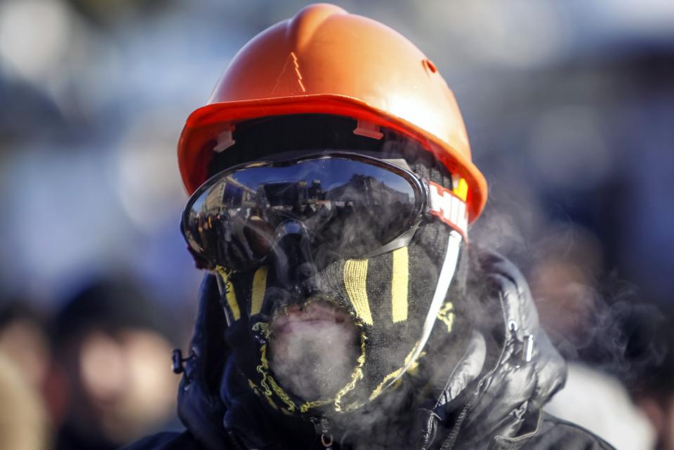 An anti-government protester looks on in the camp at Independence Square in central Kiev