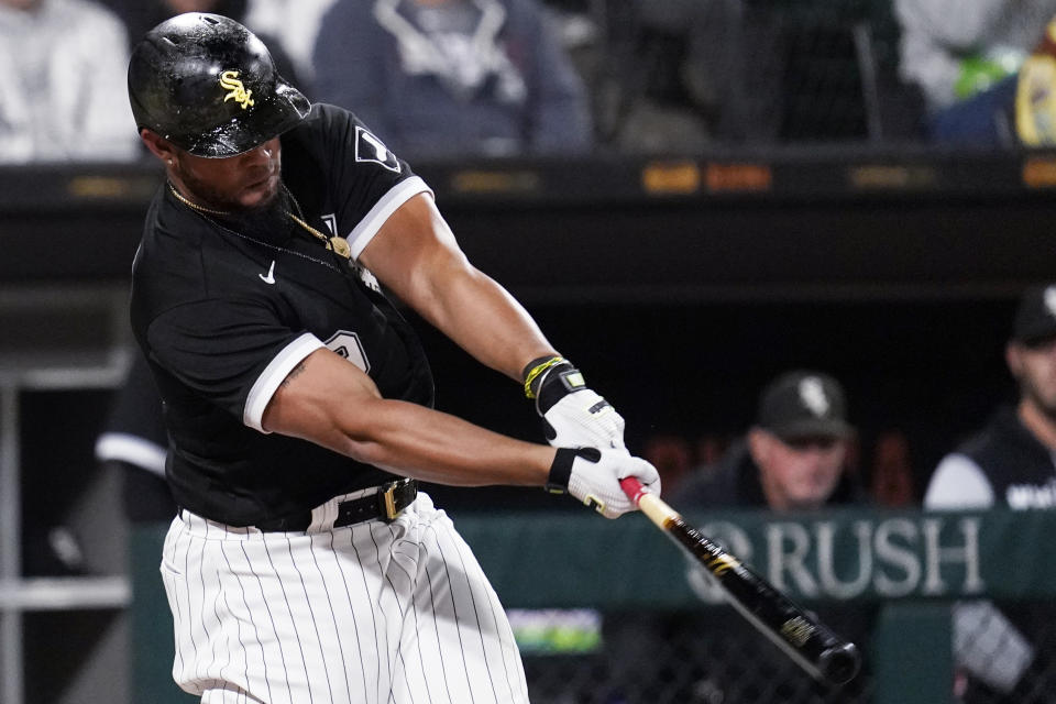 Chicago White Sox's Jose Abreu hits an RBI single during the third inning of the team's baseball game against the Detroit Tigers in Chicago, Friday, Sept. 23, 2022. (AP Photo/Nam Y. Huh)