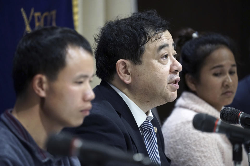 In this Nov. 28, 2018, photo, lawyer Shoichi Ibusuki, center, attends a press conference on the problems in Japan's technical intern program, with Eng Pisey, right, Cambodian technical intern and Huang Shihu, left, Chinese technical intern in Tokyo. Ibusuki, lawyer specializing in labor cases and supporting victimized foreign students and interns, called the internship program as a disguise to use trainees as mere cheap labor and should be scrapped and replaced with the new program underway. Japan is set to approve legislation that would officially open the door to foreign workers to do unskilled jobs and possibly eventually become citizens. (AP Photo/Eugene Hoshiko)