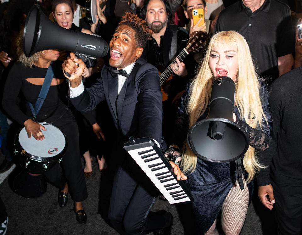 <p>Jon Batiste joins Madonna in the streets of Harlem on Oct. 9 for an impromptu performance of "Like a Prayer."</p>