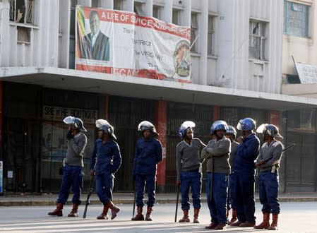 Riot police patrol the streets after police earlier banned planned protests by the opposition party Movement for Democratic Change (MDC) in Harare