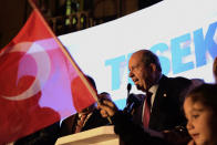 The newly elected Turkish Cypriot leader Ersin Tatar talks to his supporters after winning the Turkish Cypriots election in the Turkish occupied area in the north part of the divided capital Nicosia, Cyprus, Sunday, Oct. 18, 2020. Ersin Tatar, a hardliner who favors even closer ties with Turkey and a tougher stance with rival Greek Cypriots in peace talks has defeated the leftist incumbent in the Turkish Cypriot leadership runoff. (AP Photo/Nedim Enginsoy)