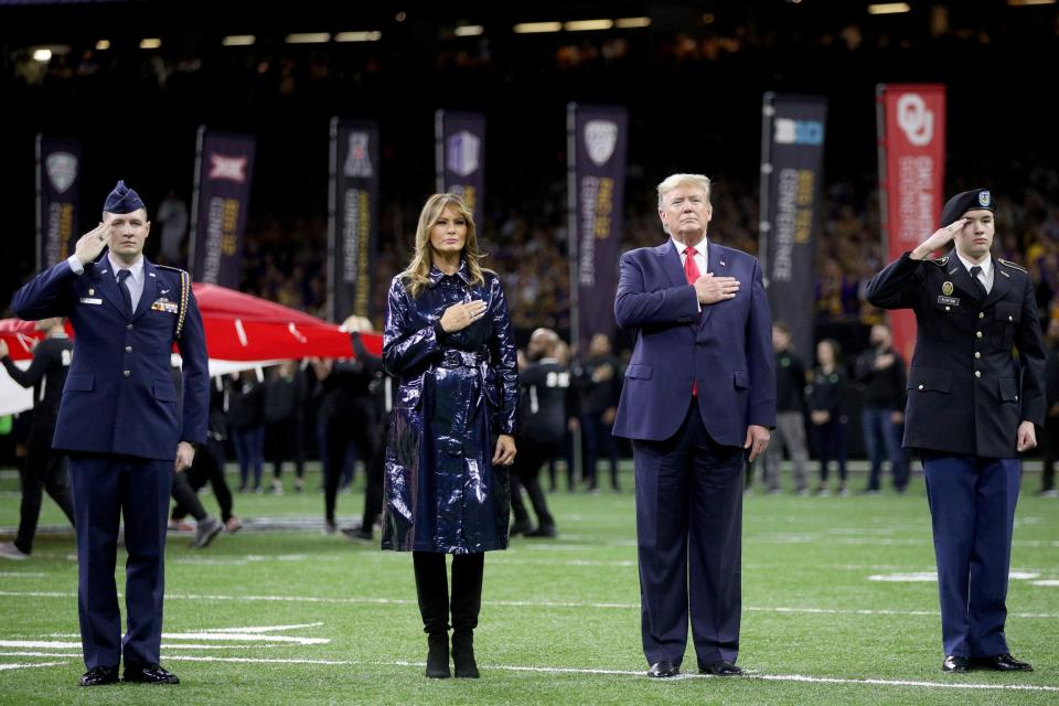 Melania Trump and Donald Trump put their hands over their hearts for the anthem (Getty Images)