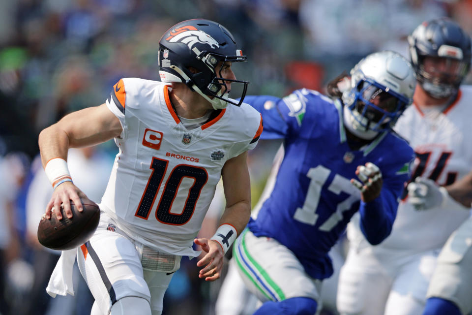 SEATTLE, WASHINGTON - SEPTEMBER 08: Bo Nix #10 of the Denver Broncos attempts a pass during the first quarter against the Seattle Seahawks at Lumen Field on September 08, 2024 in Seattle, Washington. (Photo by Rio Giancarlo/Getty Images)